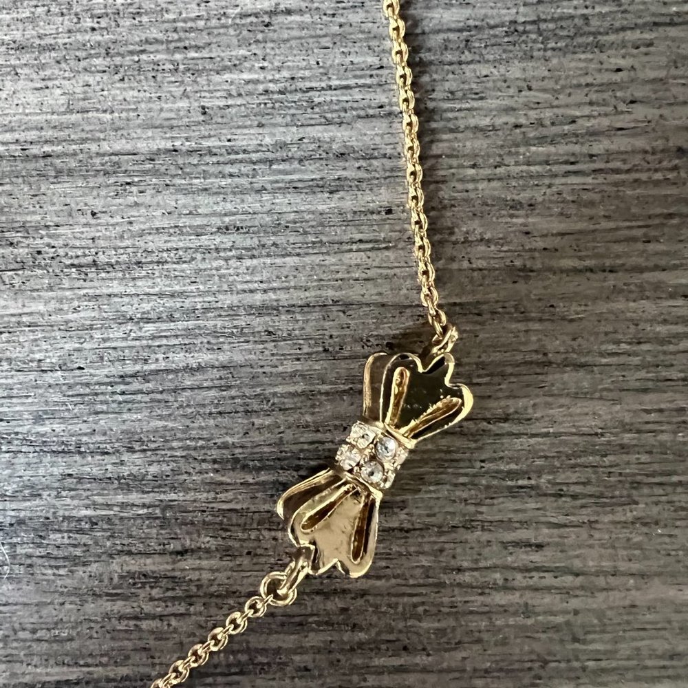 Gold Tone Kate Spade Crystal Bow Necklace - Picture 2 of 3